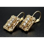 14K YELLOW GOLD DIAMOND SET EARRINGS. DIAMONDS 0.50CT. TOTAL WEIGHT 4.1G