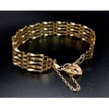 A Vintage 9K Yellow Gold Gate Bracelet with Heart Clasp. 18cm. 5.25g.