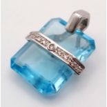 A BLUE TOPAZ AND DIAMOND PENDANT TASTEFULLY SET IN 18K WHITE GOLD, 7.3gms