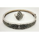 A vintage sterling silver and marquasite set of a bangle and a ring. Bangle inner diameter: 54 mm,