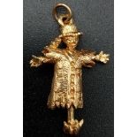 9K YELLOW GOLD SCARECROW WITH MOVING ARMS CHARM. WEIGHS 3.6G