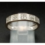 An 18K Gold and Diamond Half-Eternity Ring. 0.20ct approx. Size O 1/2. 3.3g total weight. Ref: 11910