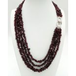 A very feminine four strand garnet necklace. Length: 47-57 cm, weight: 130 g.