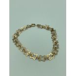 9 carat GOLD BRACELET having connecting four point Stars and complete with full UK Hallmark. 2.48