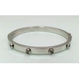 9k white gold Cartier style bangle set with 8 CZ stones, Total Weight 8.2g, 6.5cm wide