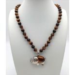 A Tigers Eye Necklace with a Tigers Eye Elephant Pendant. Elephant 4cm. Beads - 8mm. Necklace -