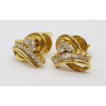 An 18 K yellow gold pair of diamond (0.60 carats) stud earrings. Weight: 6.5 g.