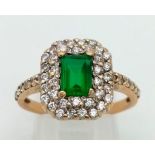 A 21k yellow gold, green and white stone ring. Size O. 5.5g total weight. Ref: 8.