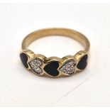 A 9 K yellow gold ring with diamond and black onyx heart, size: N, weight: 2.5 g.