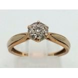 A 9 K yellow gold diamond (0.20 carats) cluster ring. Size: m, weight: 1.5 g.