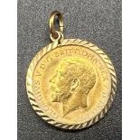 A 1915 George V Half Sovereign 22K Gold Pendant. Cased in 9k gold. 5.03g total weight.