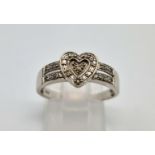 A 9 K white gold, diamond set, heart ring. Size: N, weight: 2.3 g.