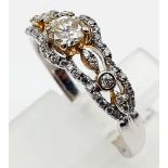 A 9K WHITE GOLD DIAMOND RING WITH .20ct CENTRE STONE 2.1gms size M