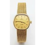 A Solid 9k Gold Omega De Ville Ladies Watch. 9k gold bracelet and case - 22mm. Gold tone dial.