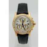 A Cartier 18K Gold Quartz Chronograph Ladies Watch. Black leather strap with Cartier 18k gold