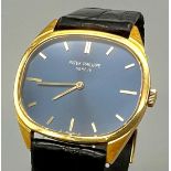 A Vintage Patek Philiippe 18K Gold Watch. Black leather strap - 18k gold buckle. 18k gold case -