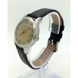 A Vintage Tissot Mechanical Unisex Watch. Black leather strap. Stainless steel case - 30mm. In