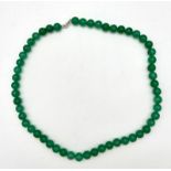 A Pale Green Jade Bead Necklace with Silver Clasp. 8mm. 52cm.