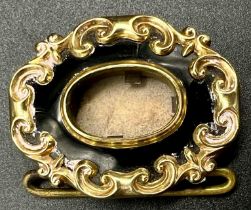 A Victorian Mid-Karat Gold and Onyx Memorial Brooch. Inscription verso for 1847. Scrolled