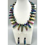 A very unusual necklace and earrings set consisting of large natural quartz crystals covered with