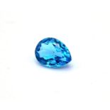 An 11ct Brazalian Topaz. Faceted teardrop shape.