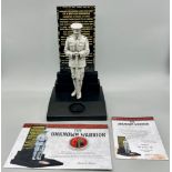A Danbury Mint - The Unknown Warrior. A striking sculpture of a WWI soldier in mourning for his lost