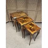 Three Vintage, Possibly Antique Louis XV style nest of tables with floral inlay. Height: 58 cm.