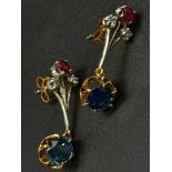 A Pair of dangler earrings with 1ct each of natural sapphires, diamonds and rubies. Set in white