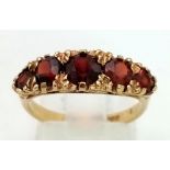 A Vintage 9K Yellow Gold Garnet Five Stone Ring. Size M. 3.06g total weight.