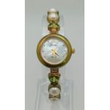 A Gems 925 Silver Quartz Ladies Watch. Pearl and peridot bracelet. MOP dial. In good condition and