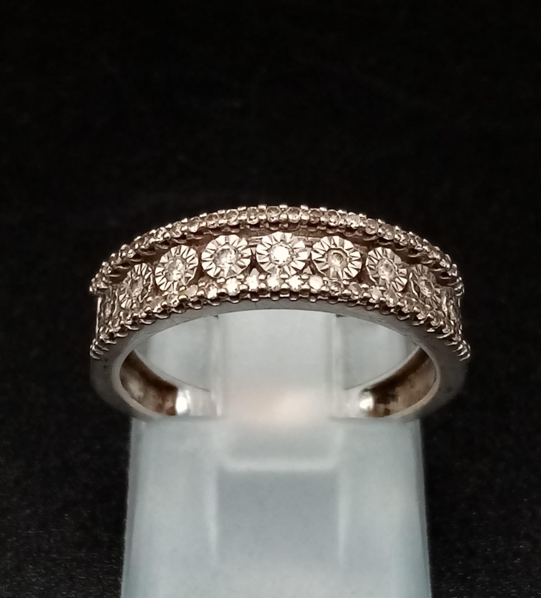 A 9K Yellow and White Gold Diamond Half-Eternity Ring. Size k. 2.56g total weight. Ref: 11912