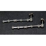 A Pair of 18K White Gold Diamond Drop earrings. 4cm drop. 1.2g total weight.