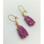 A Pair of 9K Yellow Gold and Ruby Teardrop Earrings. 2.26g total weight.