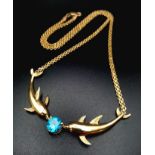14k yellow gold dolphin necklace set with blue topaz (topaz:1.55ct)