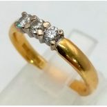 An 18K yellow gold ring with three quality diamonds (0.30 carats). Ring size: N, weight: 4.4 g.