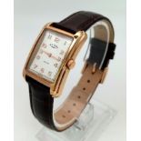 A Ladies Rose Gold Plated Rotary Portland Watch. Brown leather strap. Two-tone case - 25mm width.