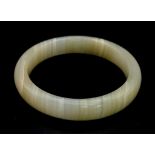 A White and Green Jade Bangle. 6cm inner diameter.