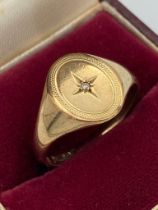 9 carat GOLD SIGNET RING, having oval form with diamond detail to centre. Full UK hallmark. 4.48