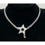 A Christian Dior White Metal Star Necklace. 36cm. Comes with a Dior case. Ref: 11950