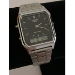 Vintage CASIO DIGITAL WRISTWATCH AQ-230. Black face stainless steel model in full working order.