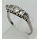 A vintage, 18 K white gold ring with five diamonds (0.25 carats). Ring size: N, weight: 2.2 g.