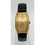 A Vintage Omega Gold Ladies Watch. Black leather strap. Gold rectangular case - 22 x 32mm. Gold tone