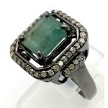 A 3.20ct Natural Emerald Ring set in 925 silver, decorated with a 0.44ct Diamond surround and