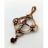 A Victorian 9K Gold Red and Pink Gemstone Circular Floral Pendant. 30mm. 2.51g total weight.