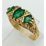 A natural 3 stone emerald and diamond 18k gold ring. Size N. 5.87g total weight. Ref: 5.