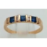 A 9 K yellow gold, diamond (0.10 carats) and sapphire 0.35 carats) band ring. size: P1/2 , weight: