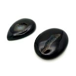 Two natural curiosities: Black agate micro-geodes, cut and polished to reveal quartz microcrystals