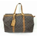 A Louis Vuitton Weekend Bag. Brown monogram canvas with leather handles and trim. 42cm width by 31cm