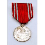 A JAPANESE WORLD WAR II RED CROSS ORDER MEDAL WITH ORIGINAL RIBBON.