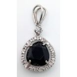 AN 18K WHITE GOLD, BLUE STONE DIAMOND PENDANT, 2.7g in weight.